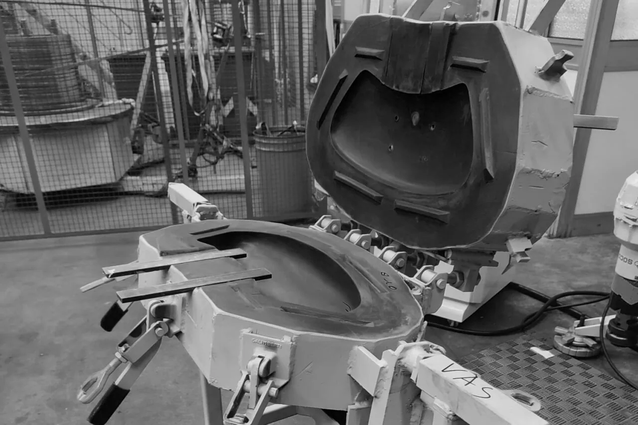Seat and backrest moulds clamped in their press in the MGR workshop (b&w)